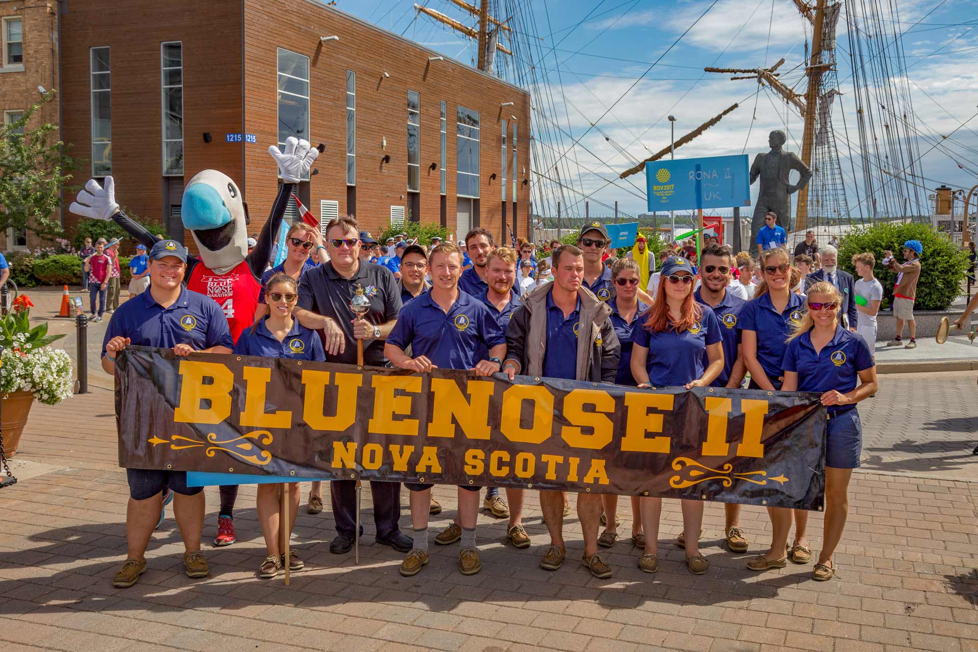 Bluenose II Team holding banner